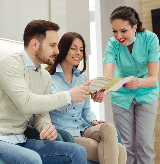 team member talking with patients